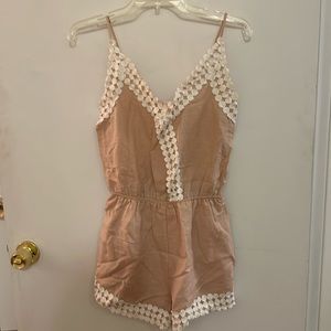 Pastel pink romper. Size small. In good condition.